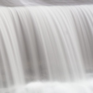 A curtain of water falls through McGowan Dam.